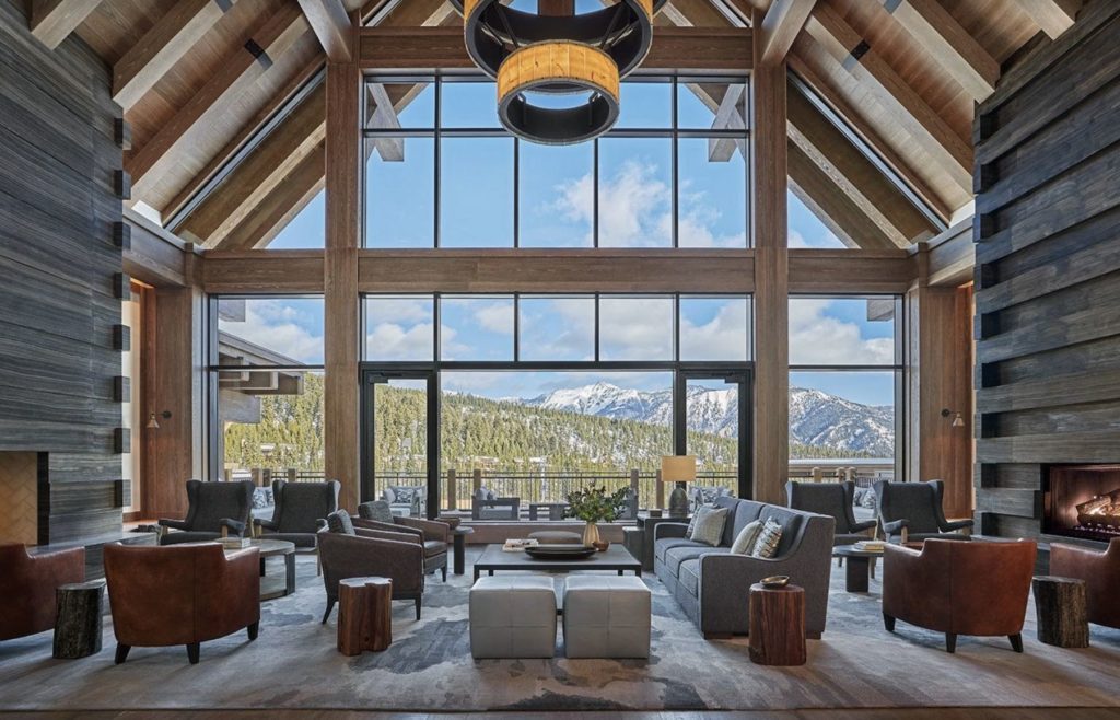 The great room with floor-to-ceiling windows onto the Spanish Peaks