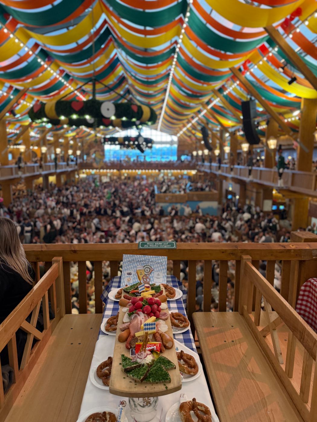 A reserved balcony table above the crowd in the Schützen-Festzelt